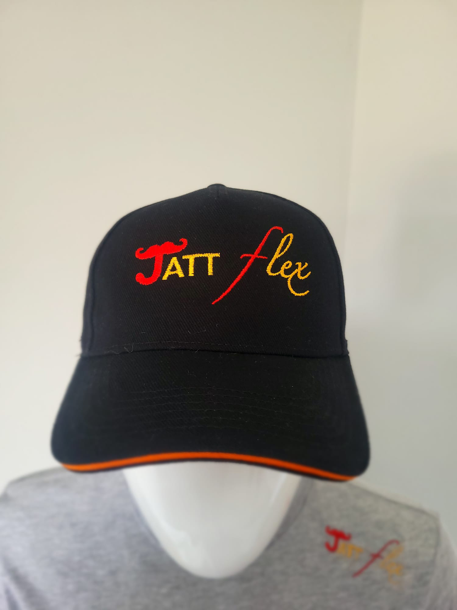 Black and orange band Jatt flex cap